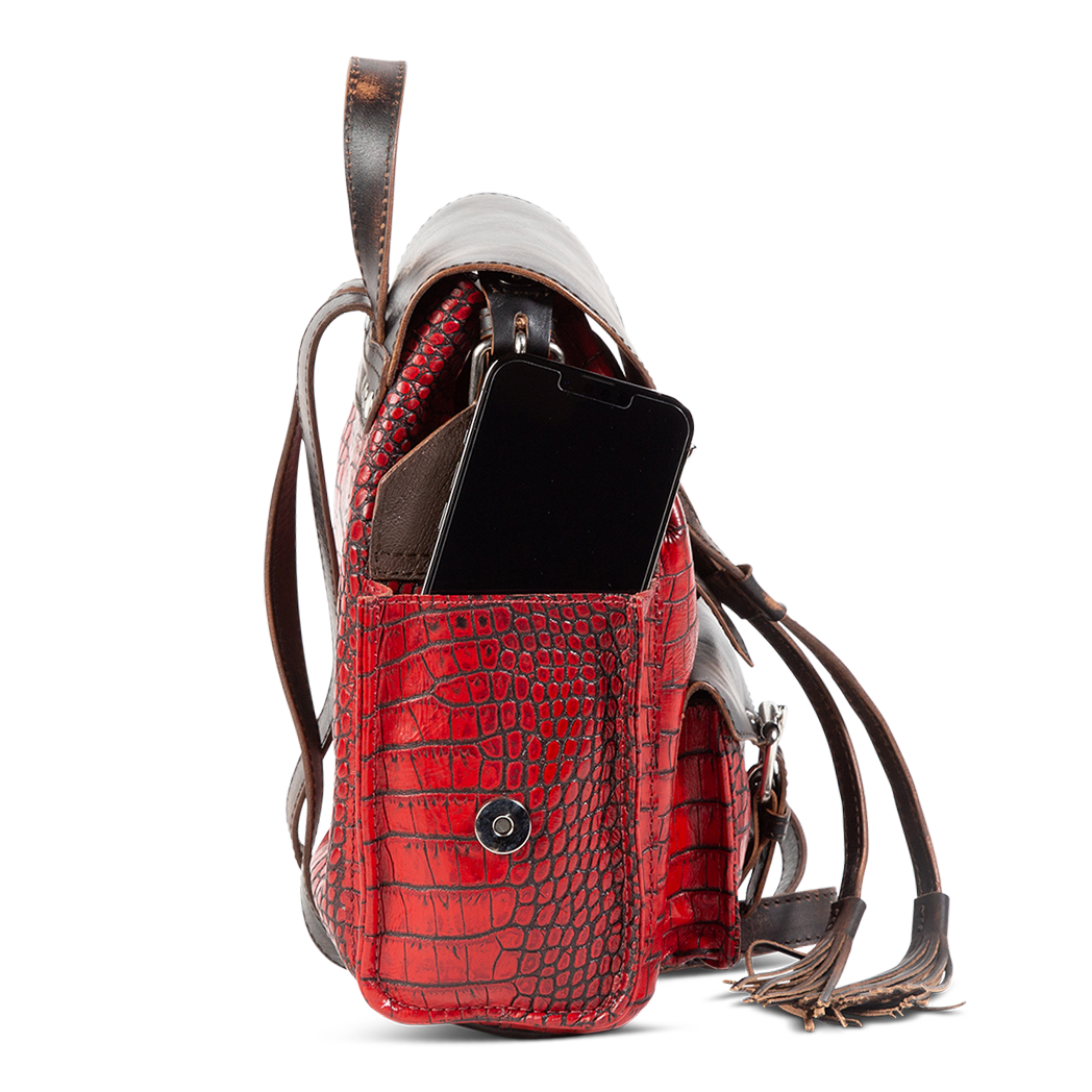 Brett red croco exterior pockets with magnetic button clasp closures and decorative silver buckles 