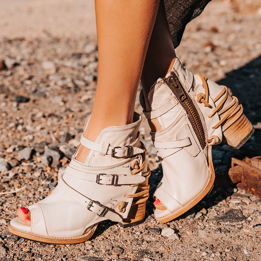 FREEBIRD women's Carterr beige sandal with back lacing and a front dip
