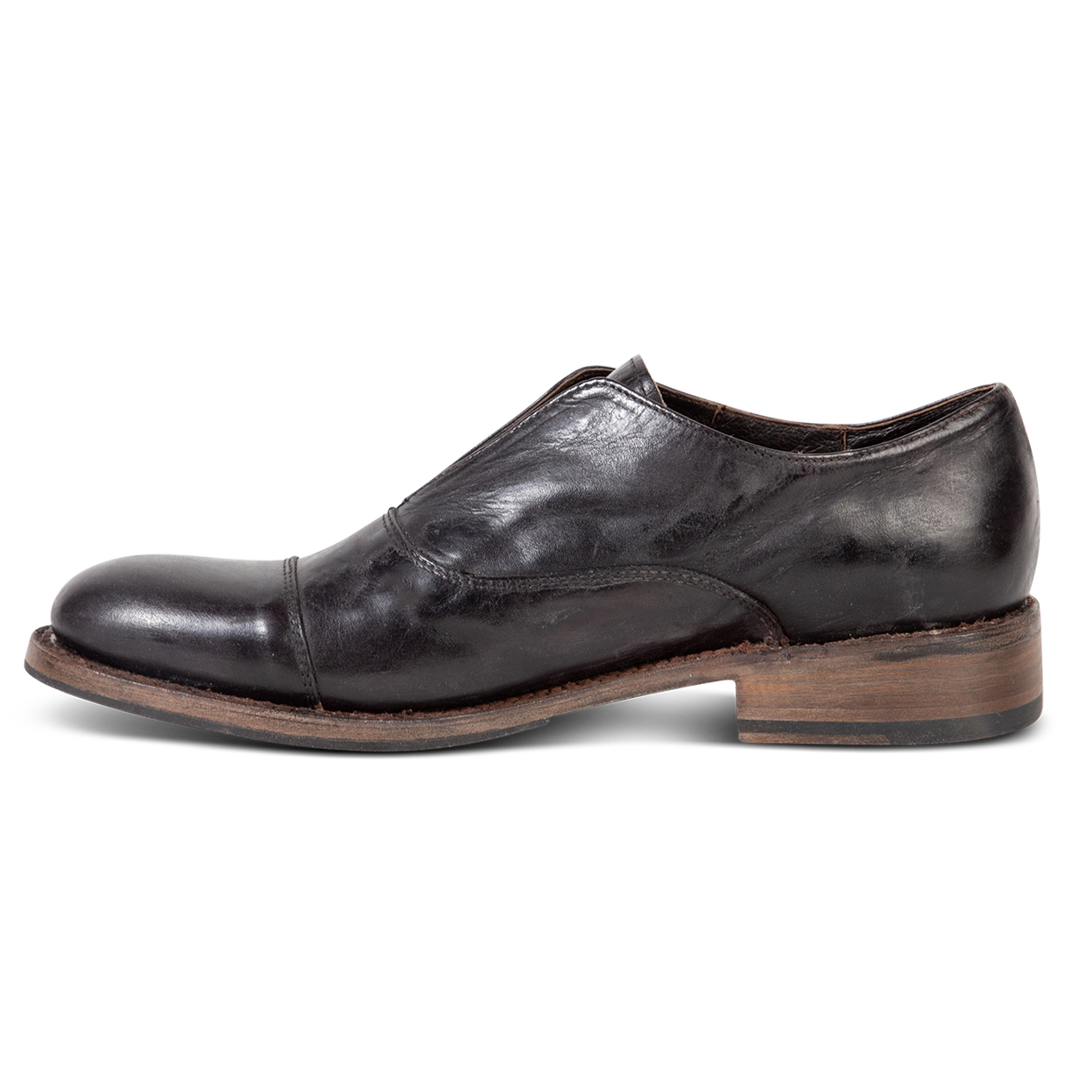 Inside view showing stitch detailing and low heel on FREEBIRD men's Detrick black shoe
