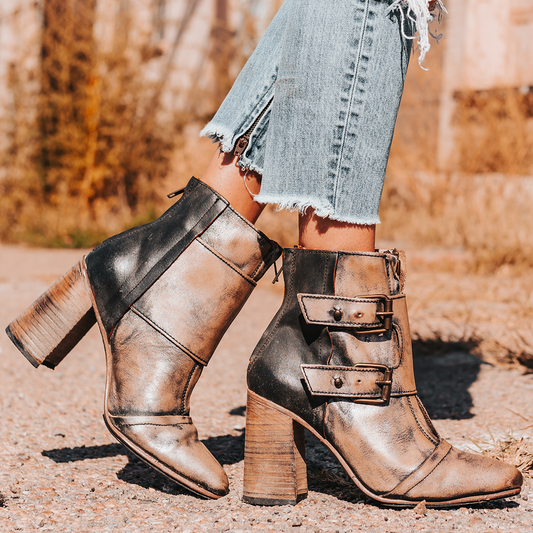 FREEBIRD women's Joey pewter embossed leather bootie with flare heel and brass buckles