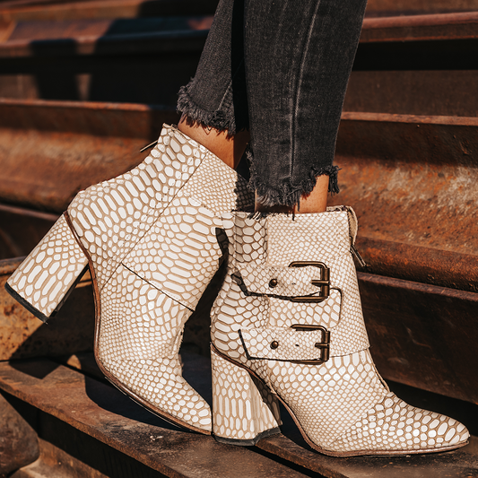 FREEBIRD women's Joey white snake embossed leather bootie with flare heel and brass buckles