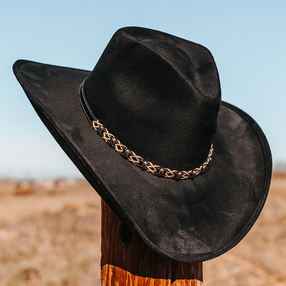 FREEBIRD Jones black western cowboy hat featuring teardrop crown, upturned-brim, and braided leather band