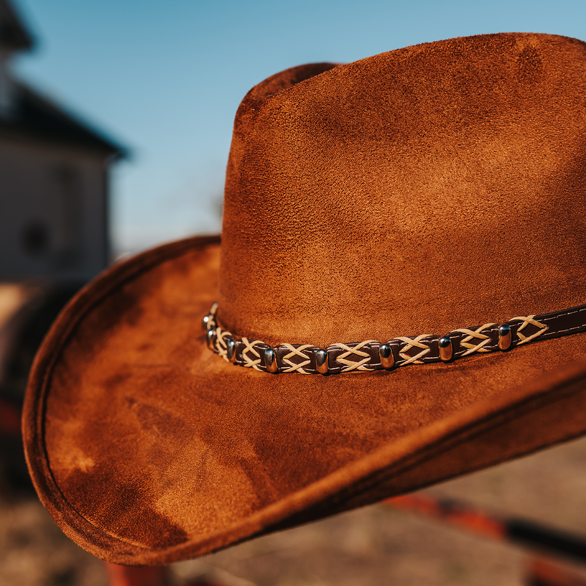 FREEBIRD Jones rust western cowboy hat featuring teardrop crown, upturned-brim, and braided leather band detailed view