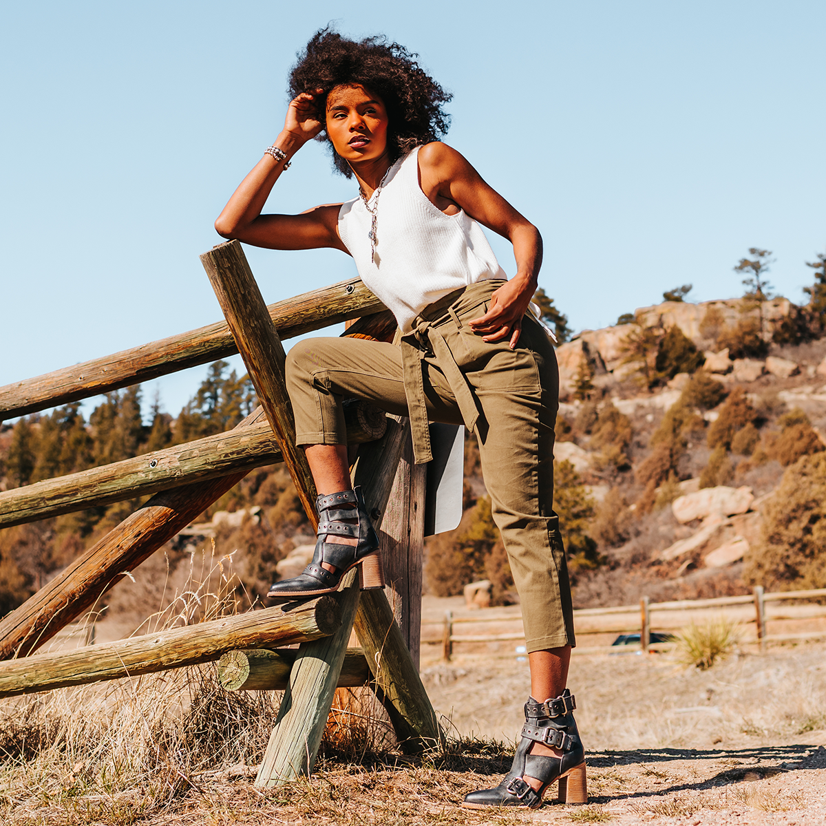 FREEBIRD women's Joplin black leather ankle bootie with buckles, flare heel, and pointed toe lifestyle