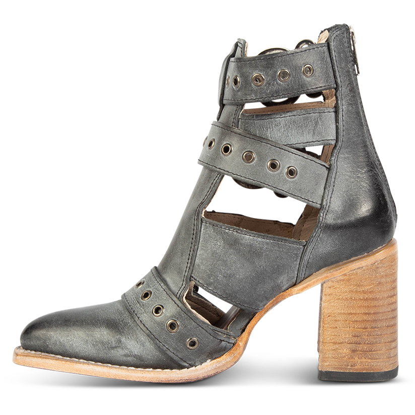 Inside view showing open cut outs and metal eyelets on FREEBIRD women's Joplin black leather ankle bootie