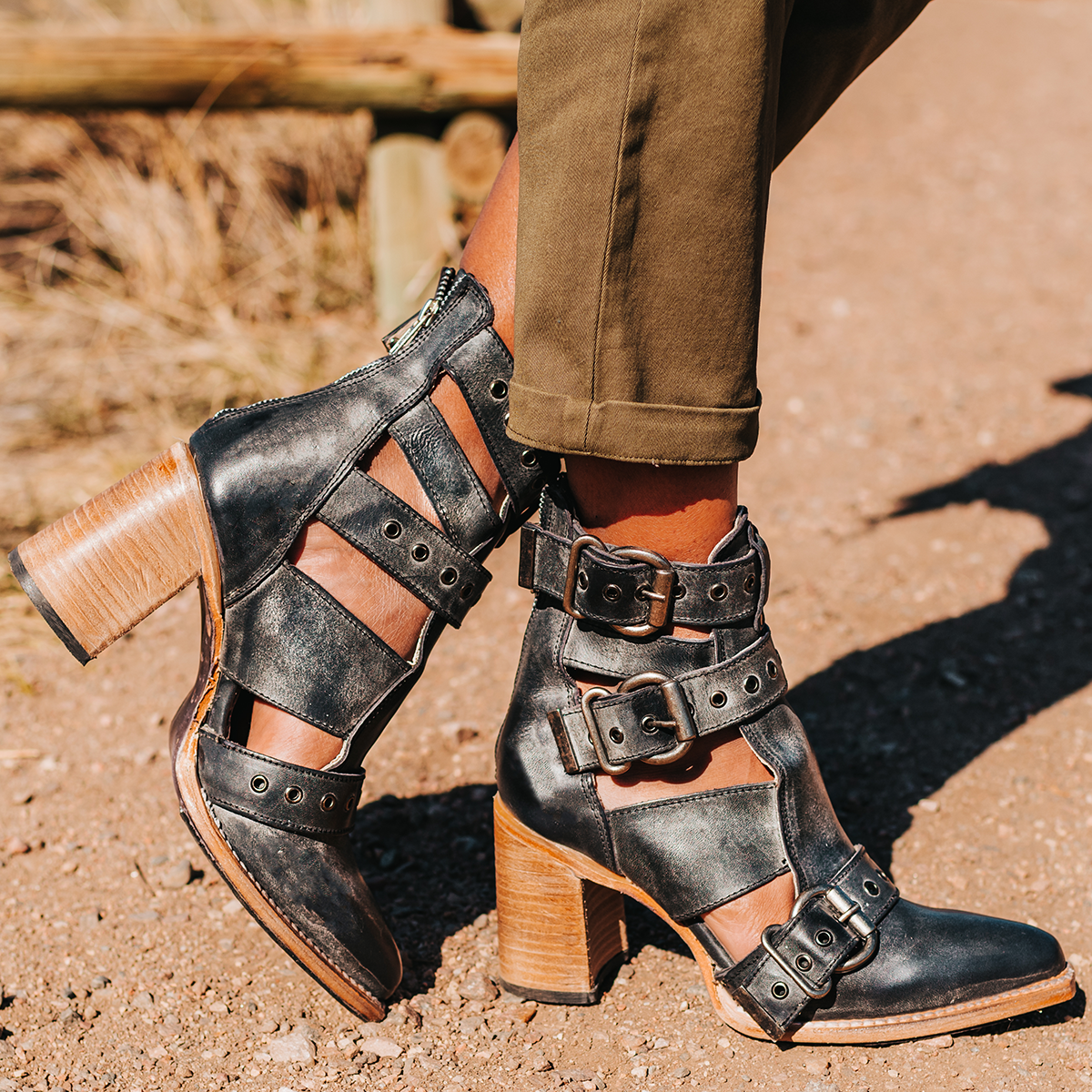 FREEBIRD women's Joplin black leather ankle bootie with buckles, flare heel, and pointed toe