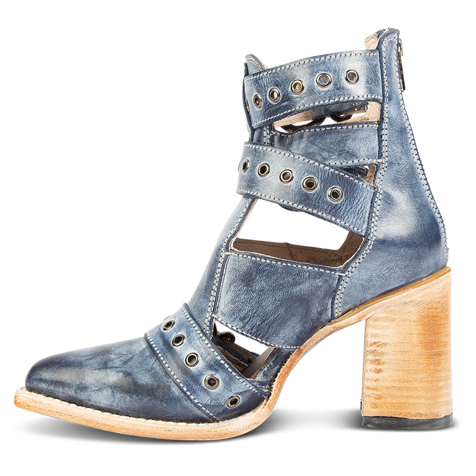 Inside view showing open cut outs and metal eyelets on FREEBIRD women's Joplin navy leather ankle bootie