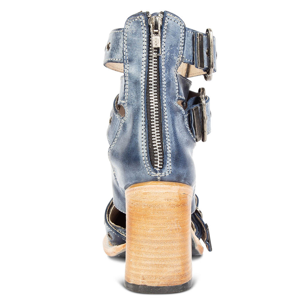 Back view showing working brass zip closure and flare heel on FREEBIRD women's Joplin navy leather bootie