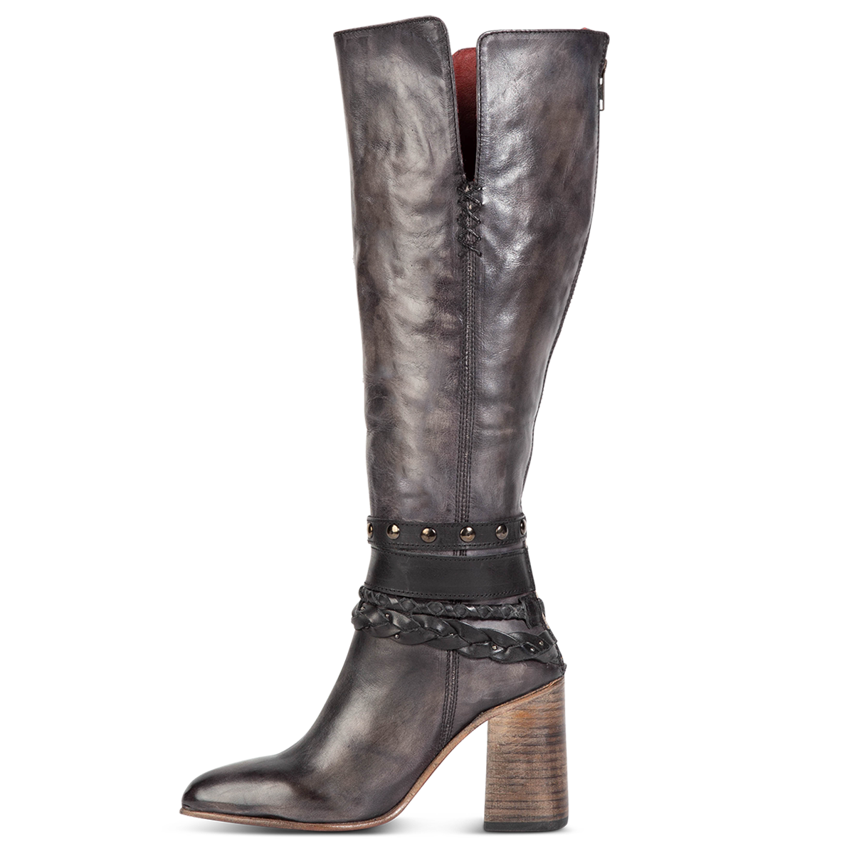 Inside view showing stacked heel, braided and studded ankle strap detailing, and side slits on FREEBIRD women's Juniper black heeled boot