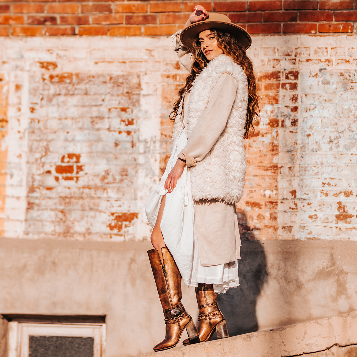 FREEBIRD women's Juniper bronze heeled boot featuring a pointed toe, back zip closure, and braided and studded ankle straps lifestyle