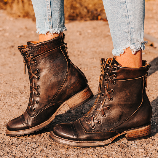 FREEBIRD women's Liverpool black front criss-cross detailing leather bootie with rubber tread sole and front/back zip closure