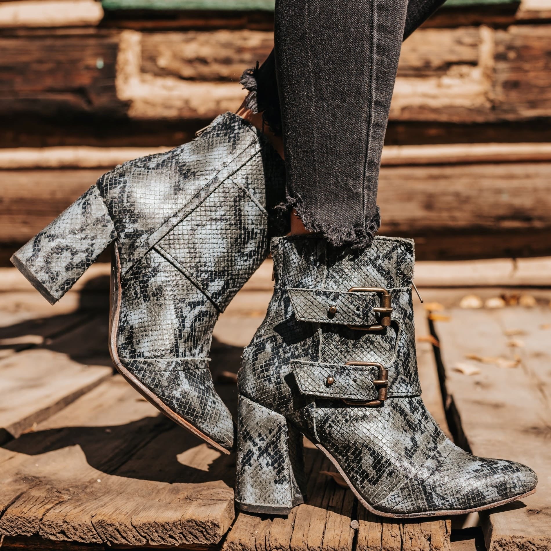 FREEBIRD women's Joey blue multi embossed leather bootie with flare heel and brass buckles