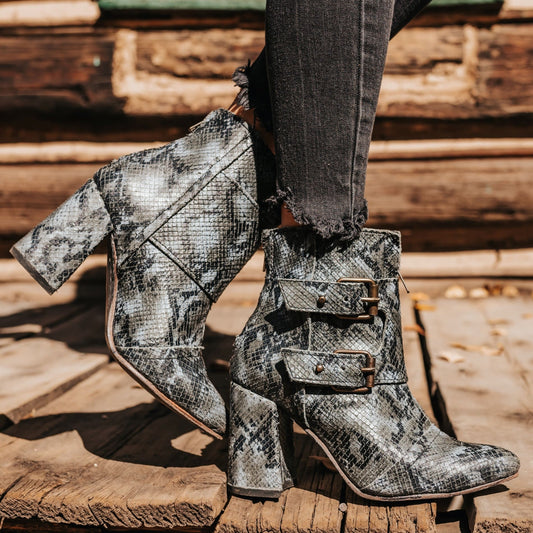 FREEBIRD women's Joey blue multi embossed leather bootie with flare heel and brass buckles