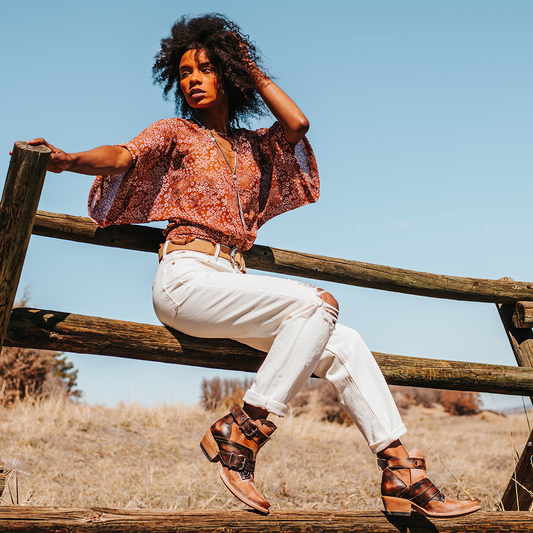 FREEBIRD women's Mayhem taupe multi western ankle bootie with exposed sides, adjustable metal buckles, and snip toe