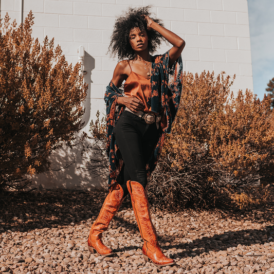 FREEBIRD women's Misty whiskey leather tall boot with western stitch detailing and traditional snip toe construction lifestyle image