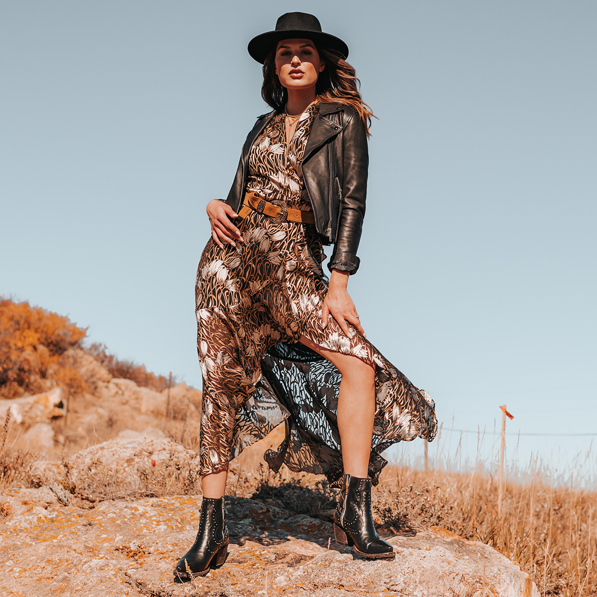FREEBIRD women's Morgan black leather ankle bootie with silver stud embellishments, gore detailing, and buckle straps lifestyle