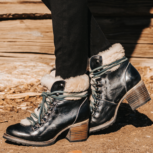 FREEBIRD women's Norway navy shearling lined heeled rubber tread sole lace up bootie