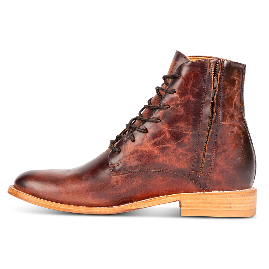 Inside view showing working zip closure, leather zipper cover, and stitch detailing on FREEBIRD men's Paxton cognac ankle boot
