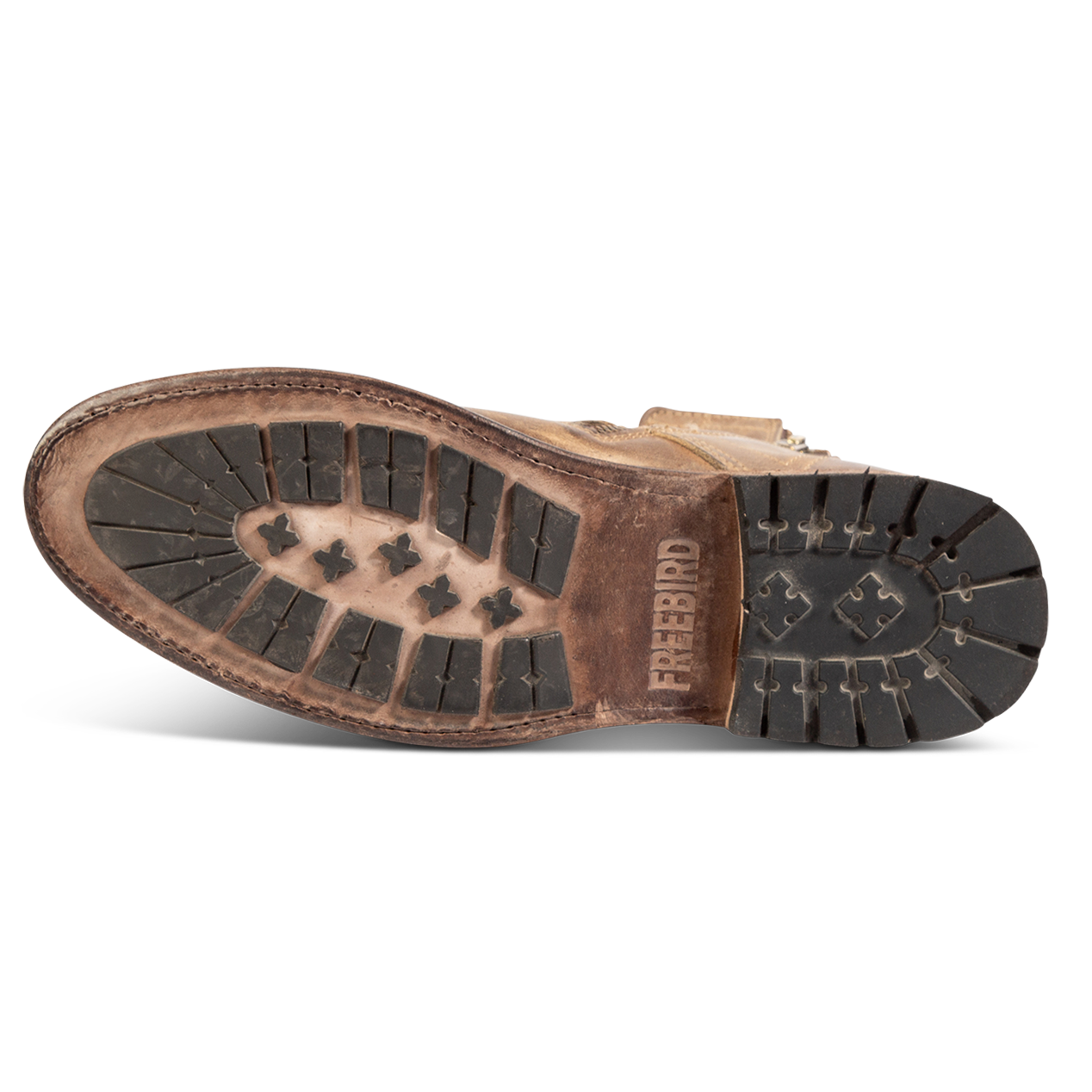 Tread leather sole imprinted with FREEBIRD on men's Pendleton tan ankle boot