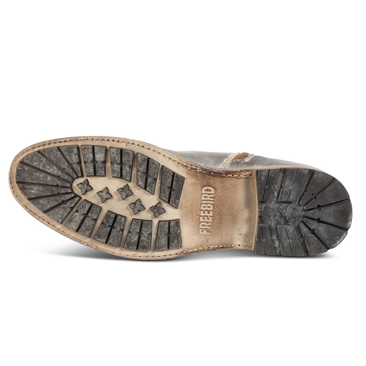 Rubber tread sole imprinted with FREEBIRD on men's Pueblo ice ankle boot