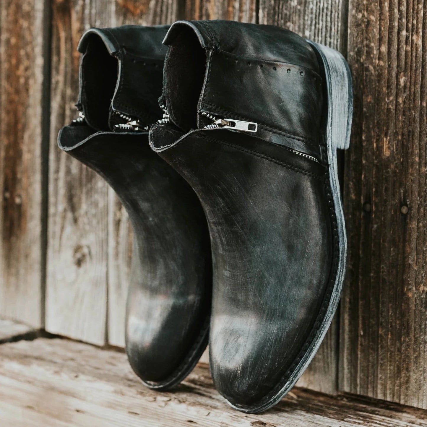 FREEBIRD men's Milo black boot with an outside and inside zip closure detail