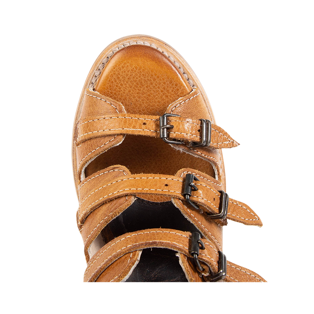Top view showing alond toe and straps on FREEBIRD women's Quinn wheat sandal
