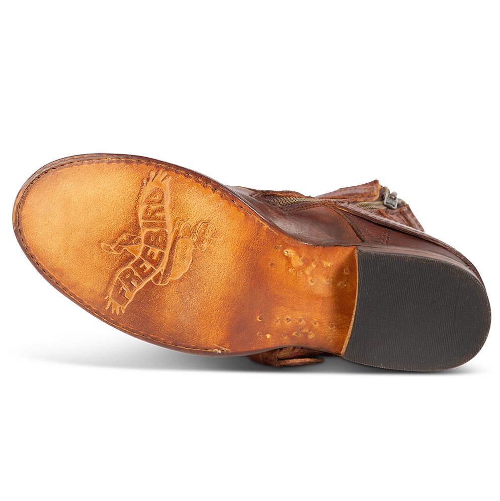 Leather sole imprinted with FREEBIRD on women's Raine cognac leather bootie
