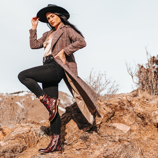 FREEBIRD women's Raine wine full grain leather bootie with inside zip closure, wooden heel, and leather overlays with metal buckles