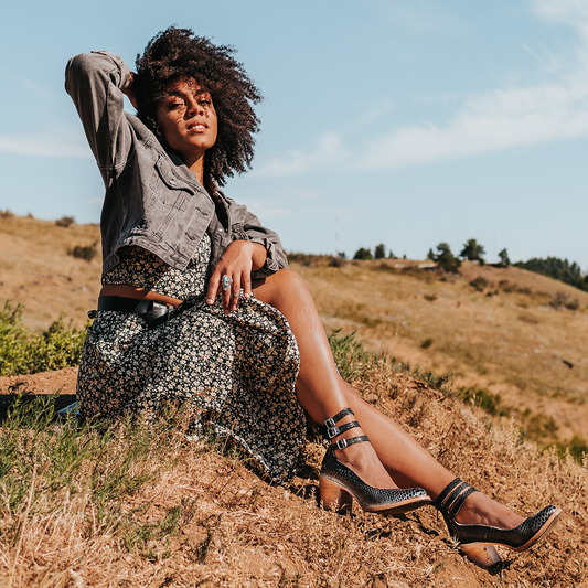 FREEBIRD women's Randi black snake embossed leather open construction ankle strap heel with adjustable rustic buckles lifestyle image