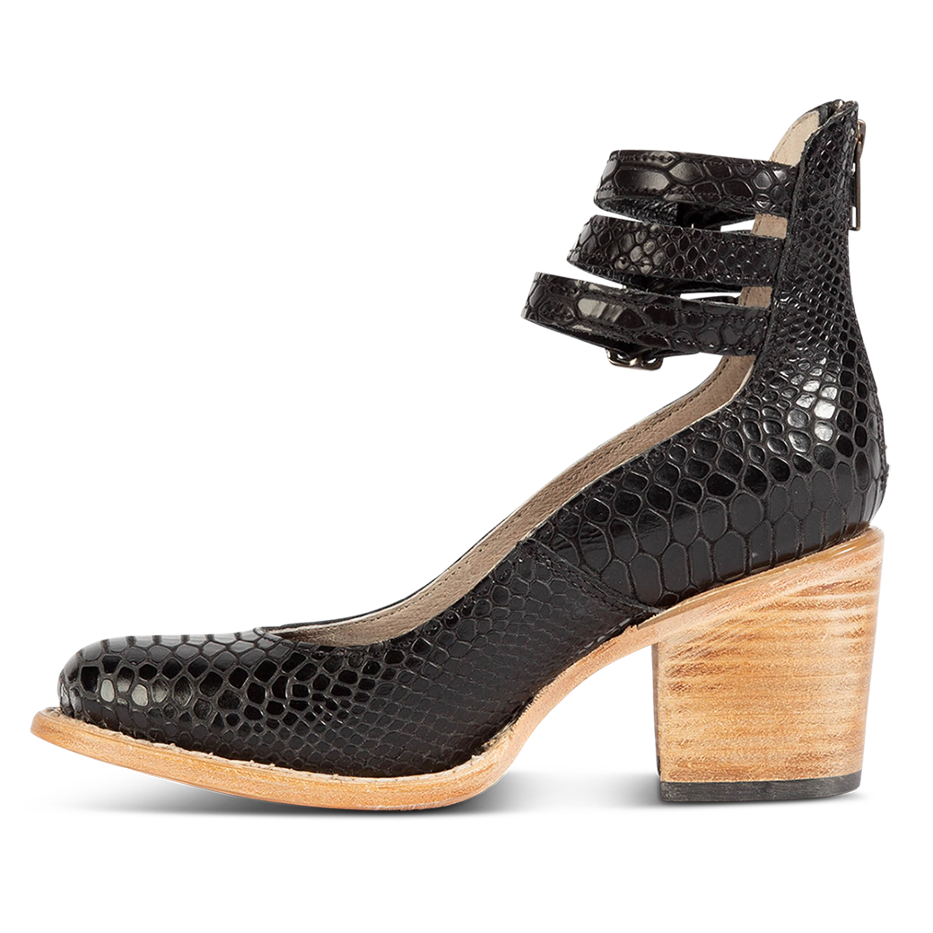 Inside view showing an open construction and wood heel with three adjustable ankle straps on FREEBIRD women’s Randi black snake shoe