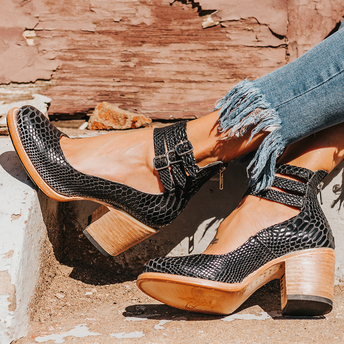 FREEBIRD women's Randi black snake embossed leather open construction ankle strap heel with adjustable rustic buckles