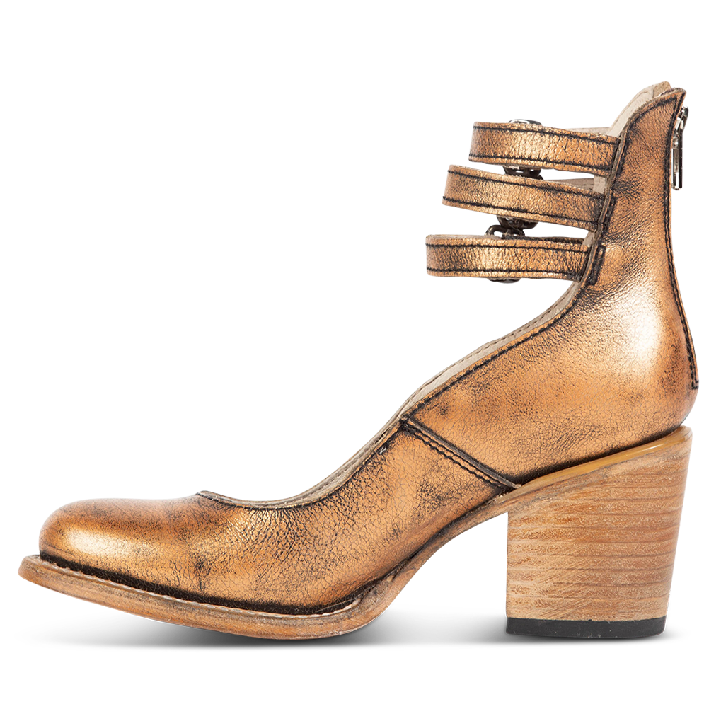 Inside view showing an open construction and wood heel with three adjustable ankle straps on FREEBIRD women’s Randi bronze shoe