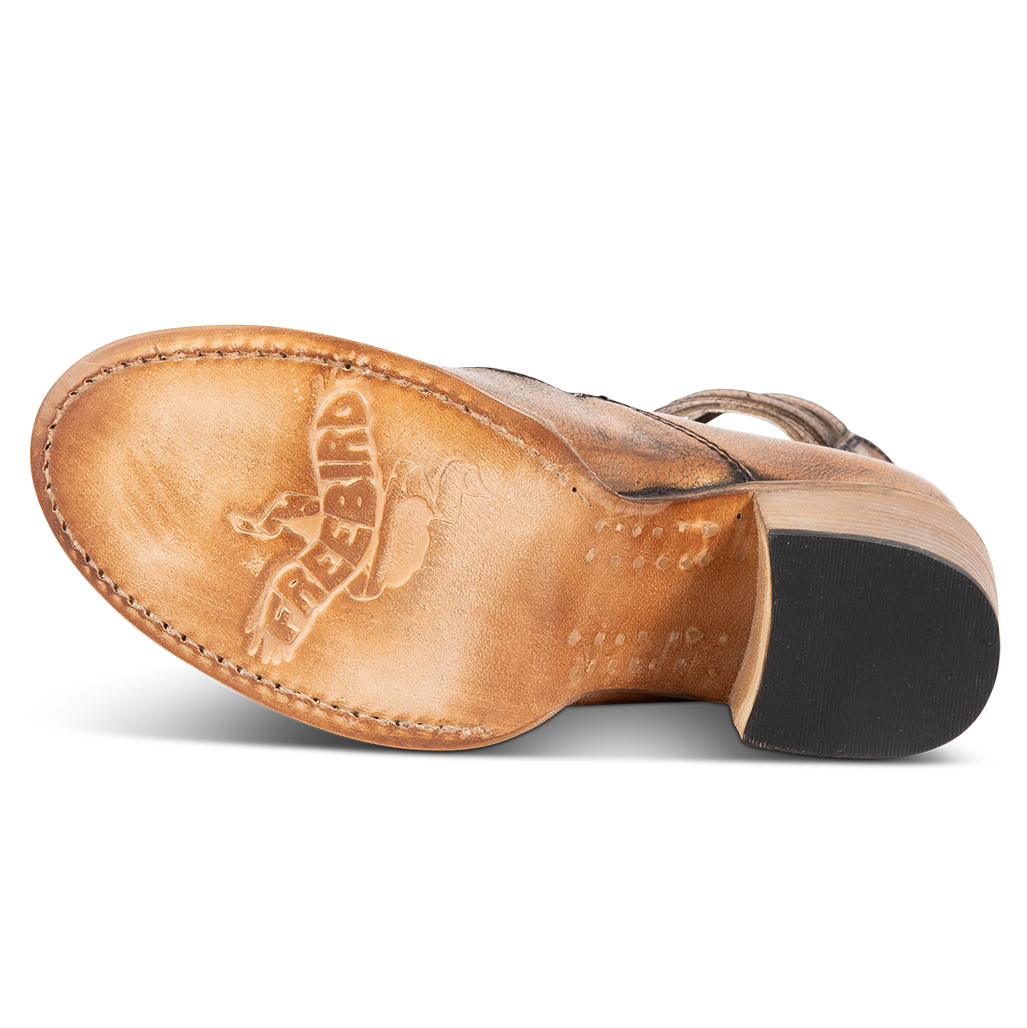 Leather sole imprinted with FREEBIRD on women’s Randi bronze shoe
