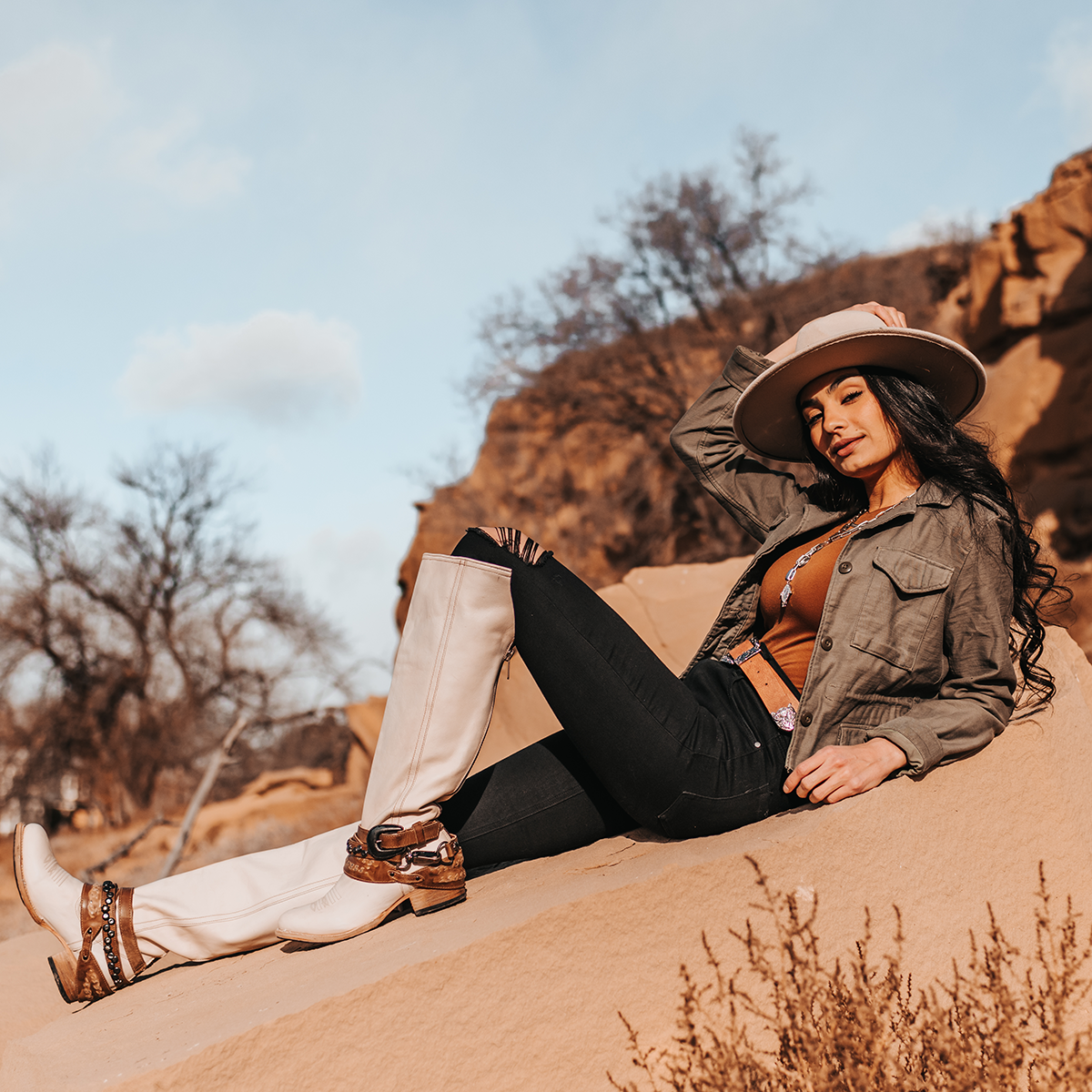 FREEBIRD women's Rodondo beige boot featuring a a relaxed silhouette, low heel, and mixed metal buckles lifestyle image