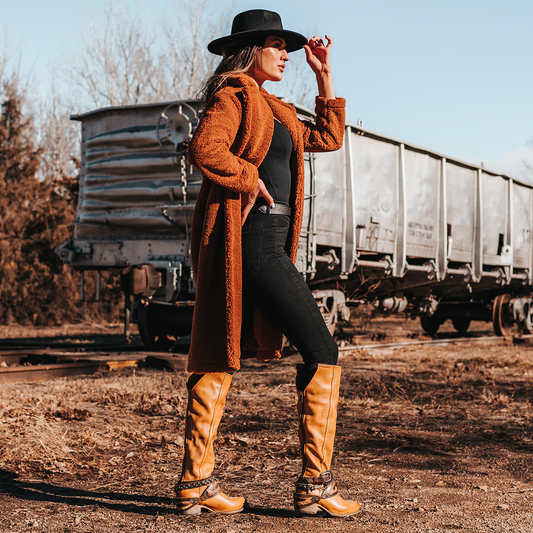 FREEBIRD women's Rodondo wheat boot featuring a a relaxed silhouette, low heel, and mixed metal buckles lifestyle image
