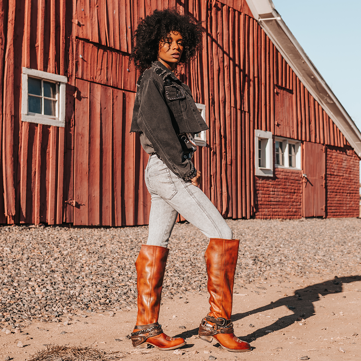 FREEBIRD women's Rodondo whiskey boot featuring a a relaxed silhouette, low heel, and mixed metal buckles lifestyle image