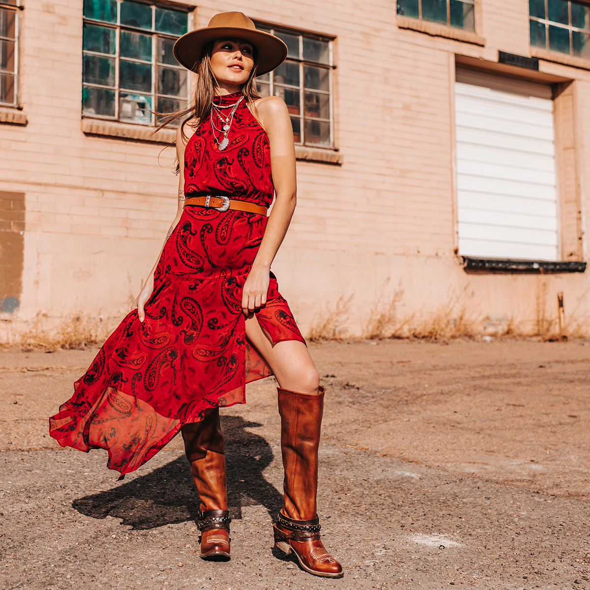 FREEBIRD women's Rodondo whiskey boot featuring a a relaxed silhouette, low heel, and mixed metal buckles lifestyle image