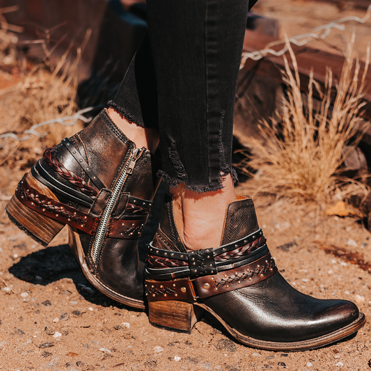 FREEBIRD women’s Sabelle black leather side cutout ankle bootie with embellished decorative belts