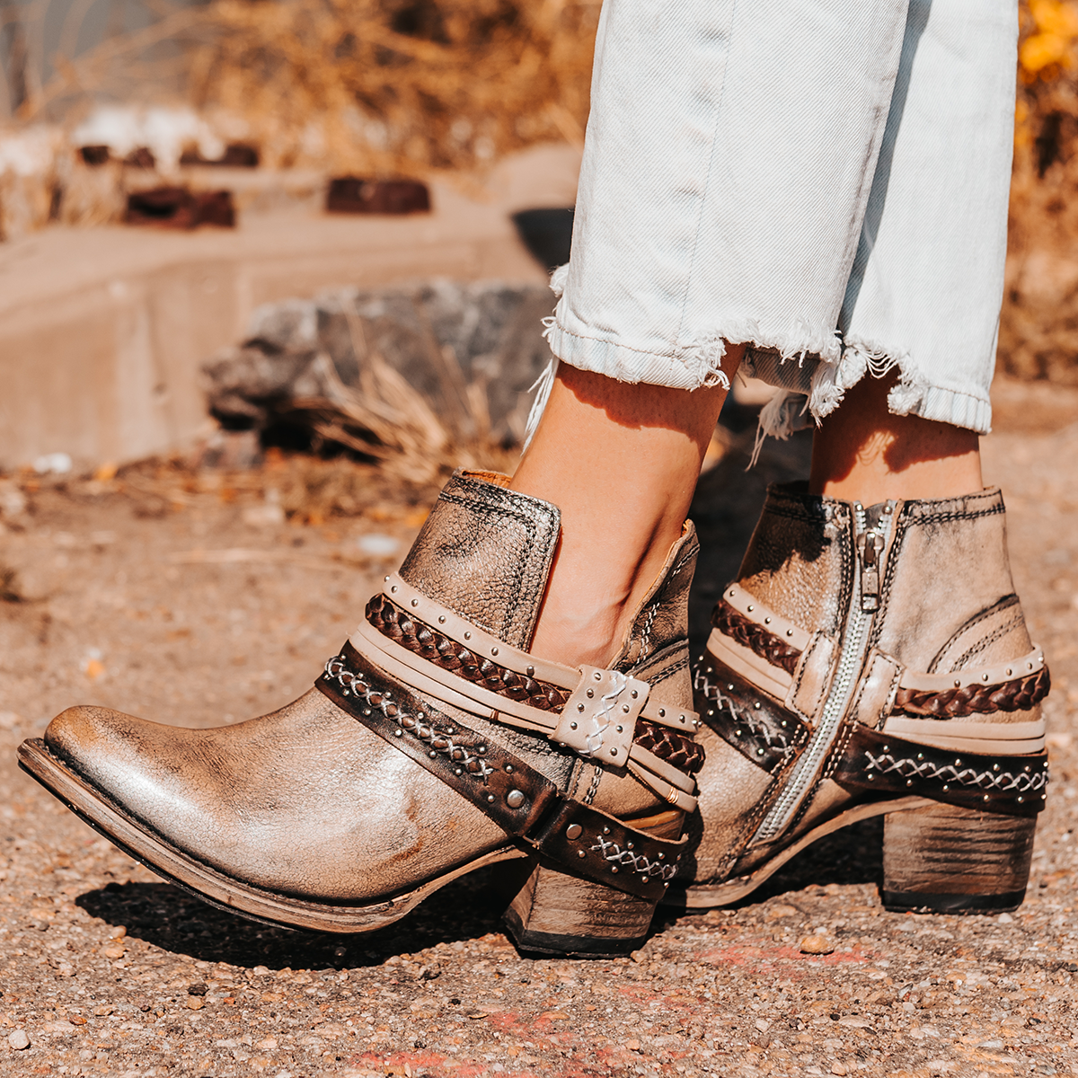 FREEBIRD women’s Sabelle pewter leather side cutout ankle bootie with embellished decorative belts