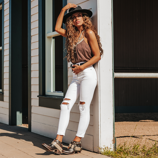 FREEBIRD women’s Saloon black leather front cutout bootie with embellished belts and side western buckle lifestyle image