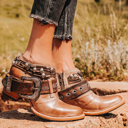 FREEBIRD women’s Saloon taupe leather front cutout bootie with embellished belts and side western buckle