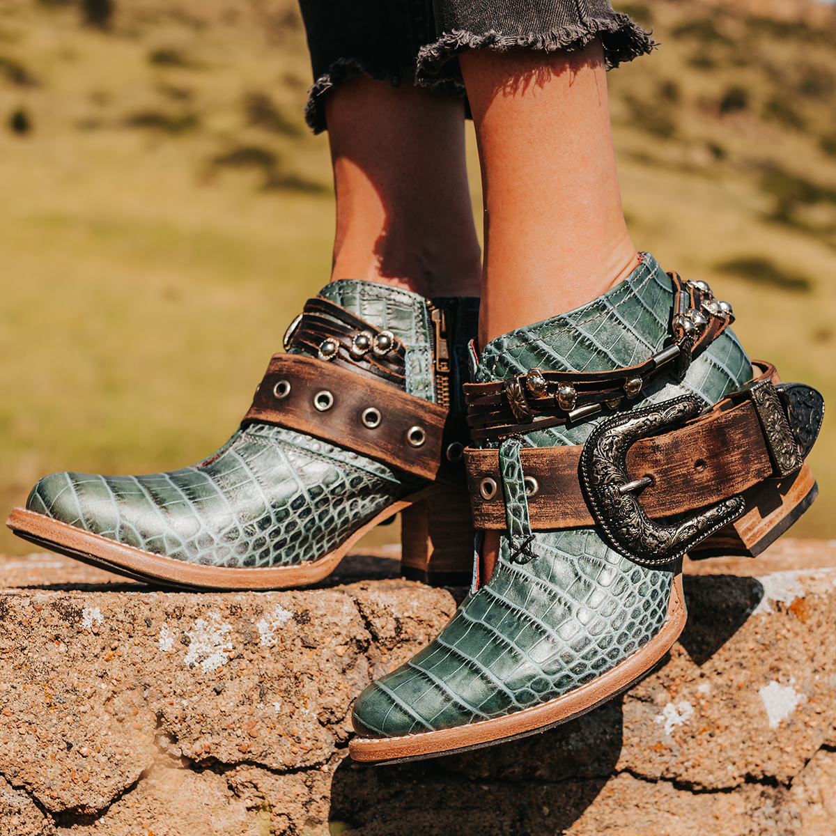 FREEBIRD women’s Saloon turquoise croco leather front cutout bootie with embellished belts and side western buckle
