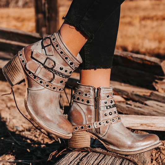 FREEBIRD women’s Sandra stone leather ankle bootie with silver stud detailing and adjustable metal buckles