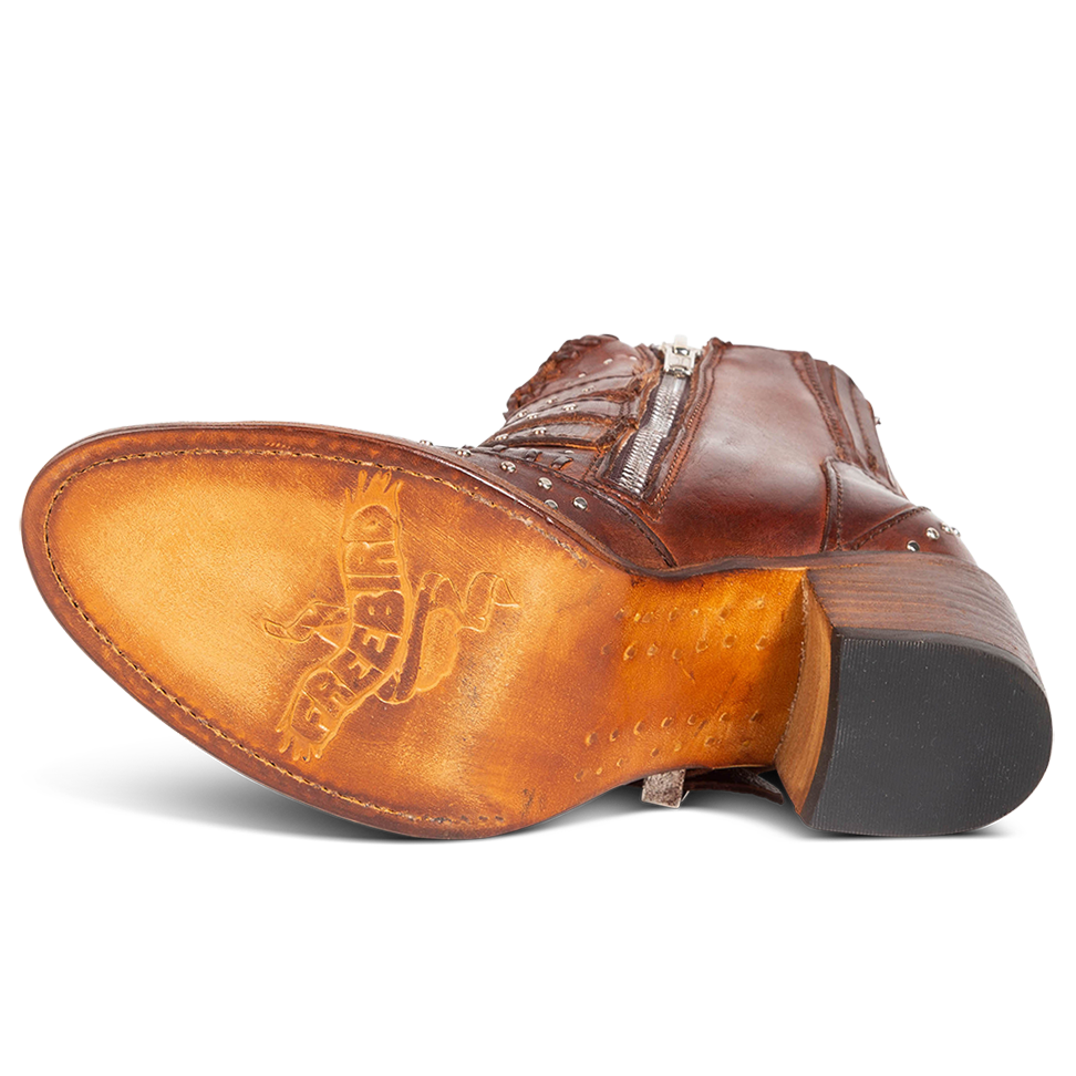 Leather sole imprinted with FREEBIRD on women's Savanna cognac leather ankle bootie