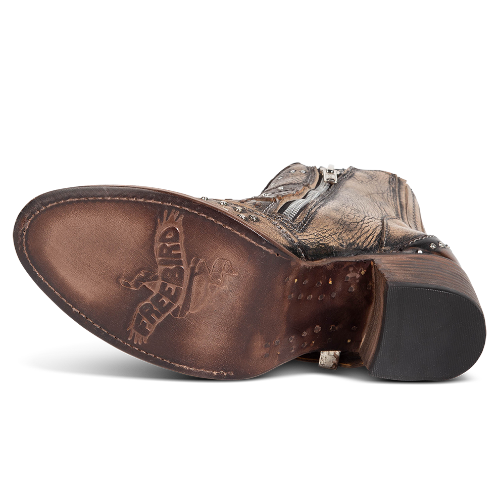Leather sole imprinted with FREEBIRD on women's Savanna pewter leather ankle bootie
