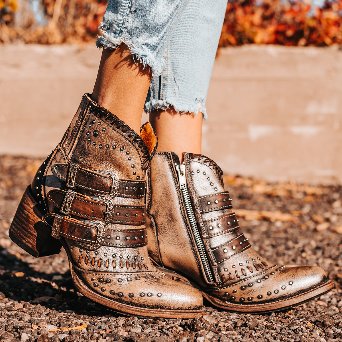 FREEBIRD women's Savanna pewter leather ankle bootie with silver studs, elastic gore, and metal buckles