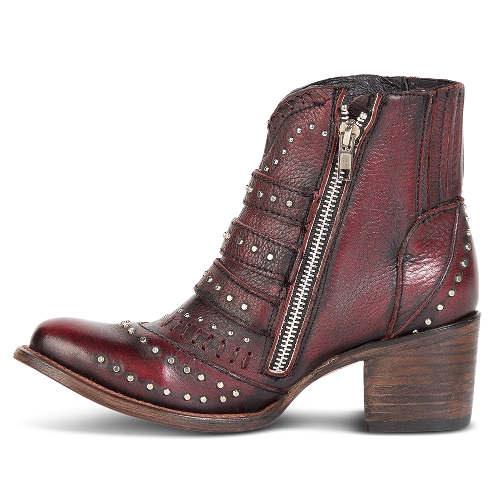 Inside view showing stud detailing and inside zipper on FREEBIRD women's Savanna wine leather ankle bootie