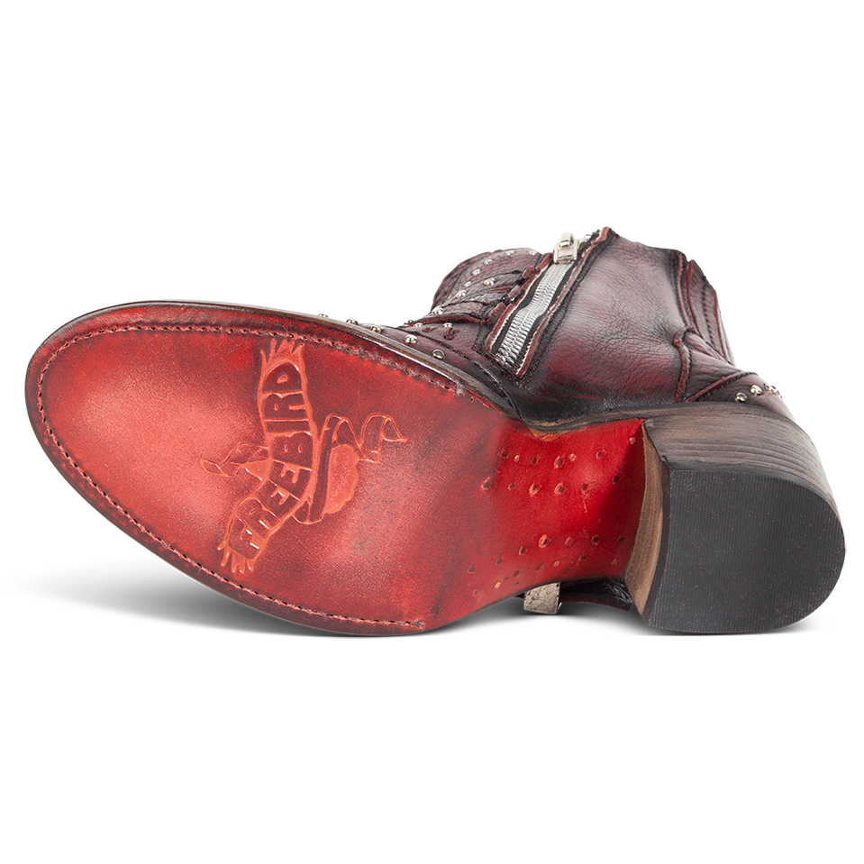 Leather sole imprinted with FREEBIRD on women's Savanna wine leather ankle bootie