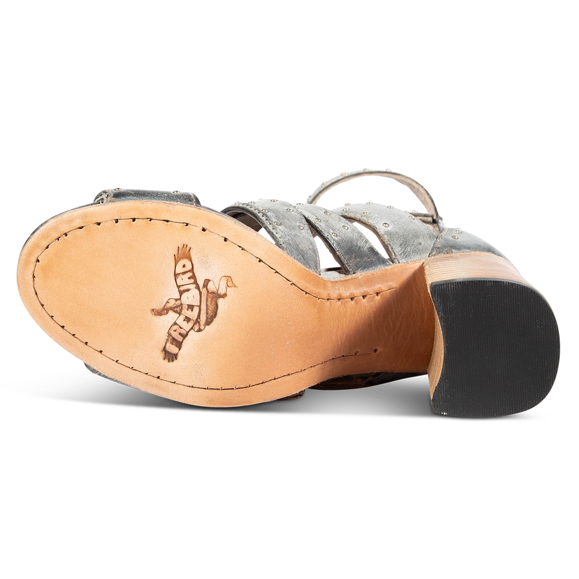 Leather sole imprinted with FREEBIRD on women's Tanica ice sandal