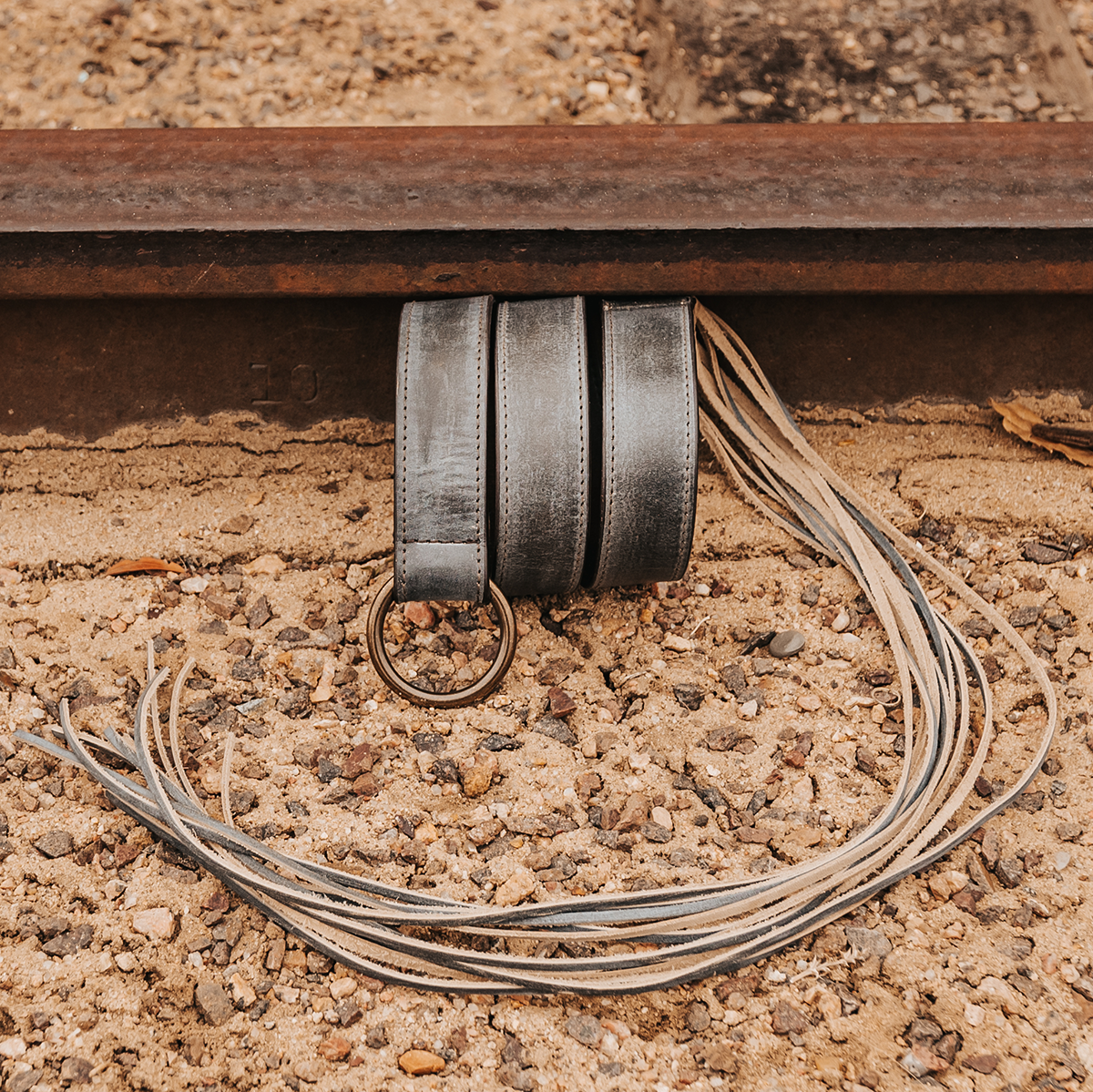 FREEBIRD Tassel ice full grain leather belt featuring rustic loop and tassel detailing